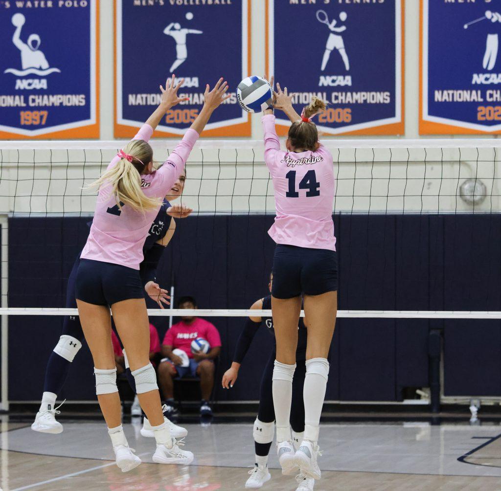 Hendrickson and junior middle blocker Kenadie Patterson go for a block against the Gaels on Oct. 17, at Firestone Fieldhouse. This duo combined for 10 block assists.