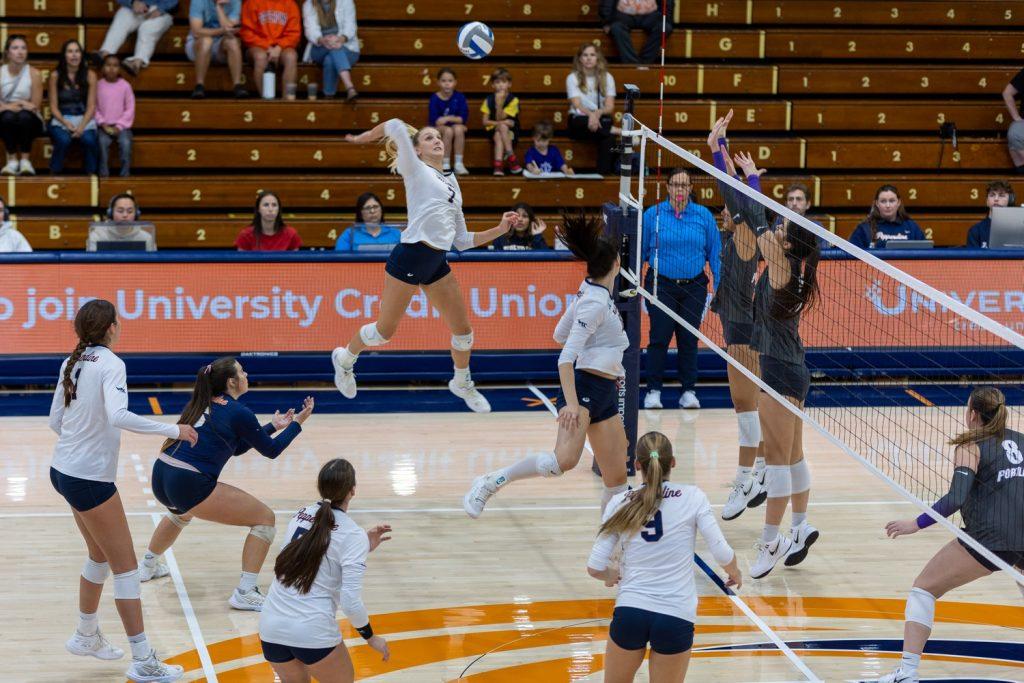 Graduate outsider hitter Birdie Hendrickson goes for the kill against Portland on Oct. 19 at Firestone Fieldhouse. Hendrickson ended the match with 16 kills along with five digs.