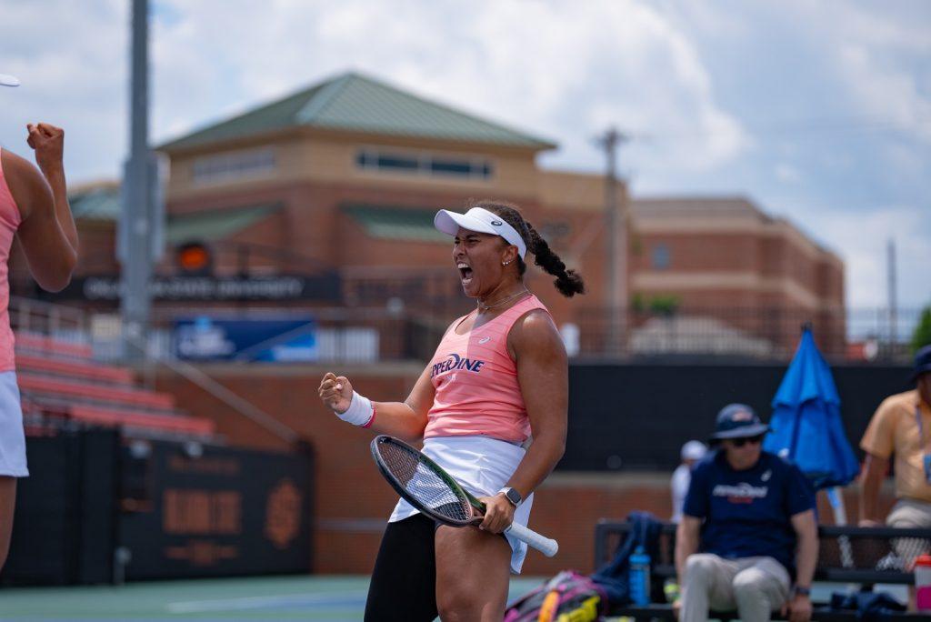 Senior Women's Tennis player Savannah Broadus celebrates after a point against University of Michigan at Michael and Anne Greenwood Tennis Center on May 17. Broadus and her doubles partner, alumni Janice Tjen ('24), secured the doubles point for an overall 4-1 win. Photos courtesy of Pepperdine Athletics