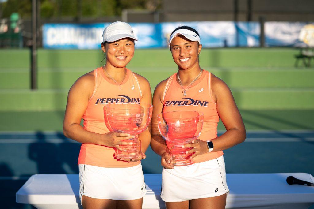 Alumni Janice Tjen ('24) (left) and Broadus (right) hold their 2022 ITA Fall Nationals trophy Nov. 6 at the Barnes Tennis Center in San Diego. The pair were also named All-Americans for the second time in their careers.