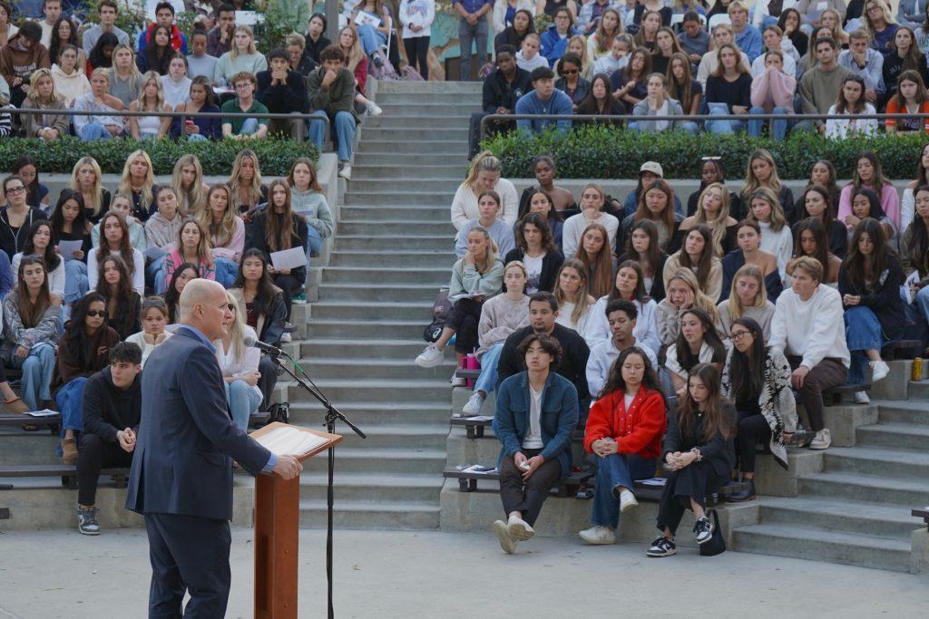 President Jim Gash speaks to the Pepperdine community Oct. 17 in the Amphitheatre. With helicopters circling overhead, Gash led the community in prayer for a crash on PCH that happened during the ceremony.