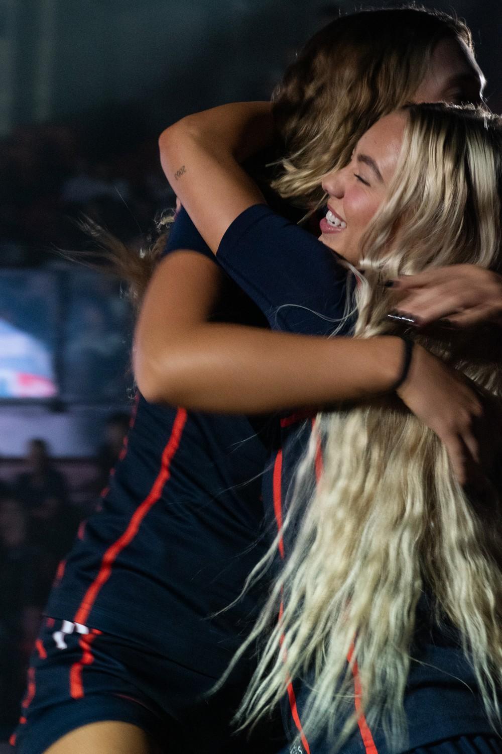 Senior guard Addi Melone embraces her teammate during Blue and Orange Madness on Oct. 4, at Firestone Fieldhouse. Women's Basketball season opener is at home Nov. 1 against Westcliff.