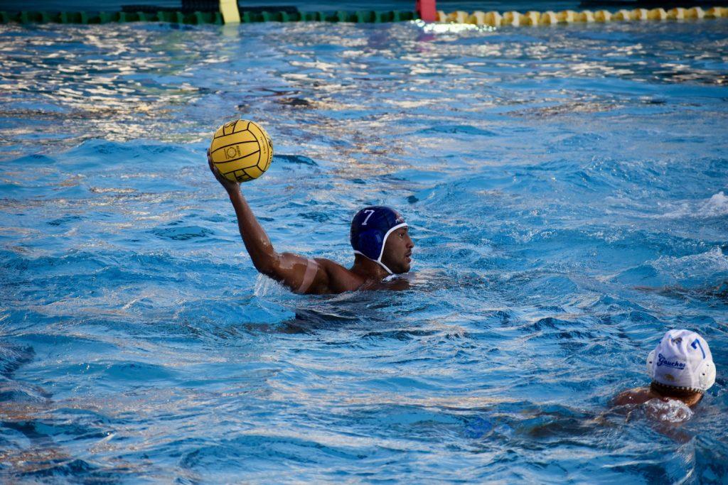 Fifth-year attacker Christian Hosea holds possession against UC Santa Barbara on Sept. 19 at Raleigh Runnels Memorial Pool. Through 13 games, Hosea leads the team in goals with 44. Photo by Mary Elisabeth