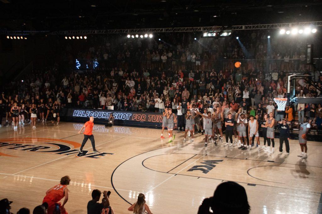 President Jim Gash lets it loose for his traditional half-court shot for Blue and Orange Madness on Oct. 4, at Firestone Fieldhouse. Gash made the bucket in 2023, however, he could not go back-to-back. Photos by Perse Klopp