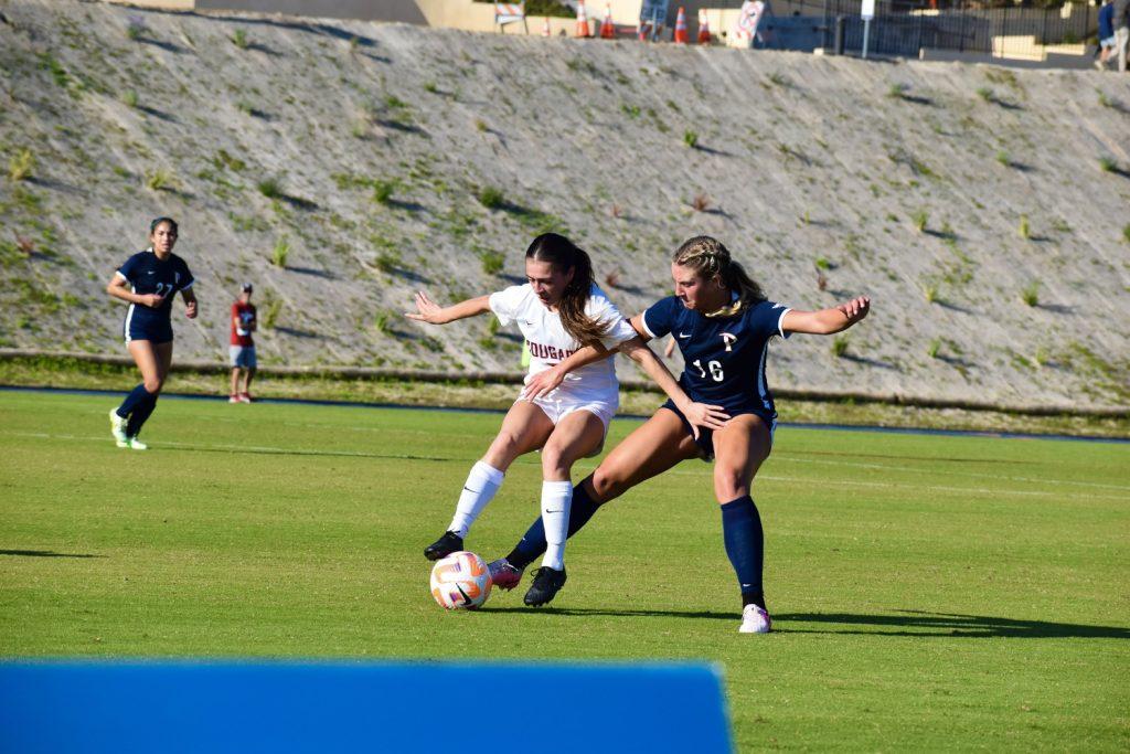 Sophomore defender Peyton Leonard fights for possession on defense Oct. 2 at Tari Frahm Rokus Field. Leonard has scored 3 goals this season. Photos by Mary Elisabeth