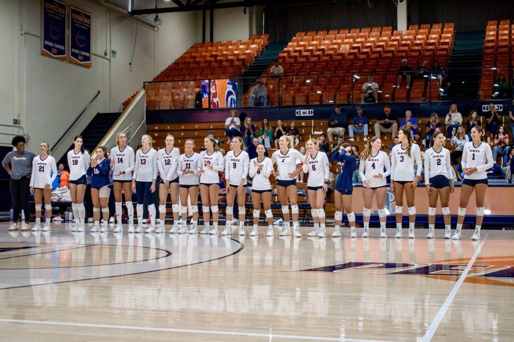 The Pepperdine Women's Indoor Volleyball team stands side-by-side before playing USC on Aug. 31, in Firestone Fieldhouse. The team places an extra emphasis on the mental health of each player.