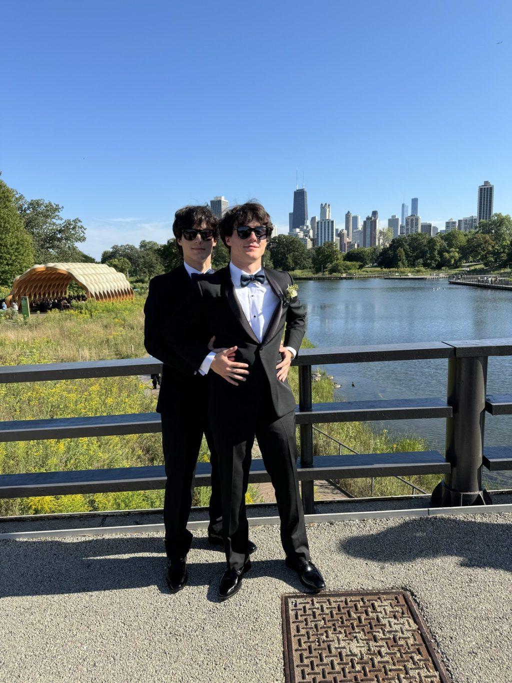 Senior twins Matthew Covaci (left) and Albert Covaci (right) pose for a groomsmen photo during a wedding in Chicago on Aug. 31. The two said they often get called by the wrong name due to their identical appearance. Photo courtesy of Matthew Covaci