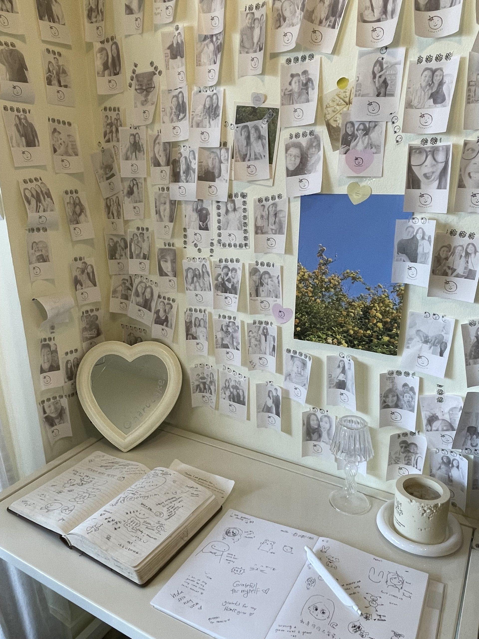 Photos of customers fill the walls, stuck on with decorative pieces of tape Sept. 21. This corner held the guestbook with pages filled with doodles and phrases.