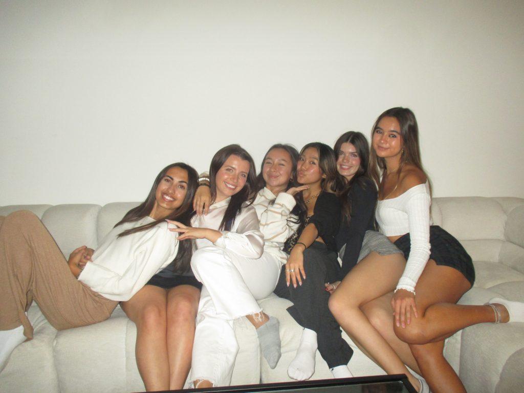 From left to right: Asha Weir, Lauren Callihan, Coco Crandall, Rin Takahashi, Niamh Rolston and Hannah Schendel pose for a picture together on a couch. Many of the girls' friends recall the little moments spent together as their favorites. Photo courtesy of Hannah Schendel