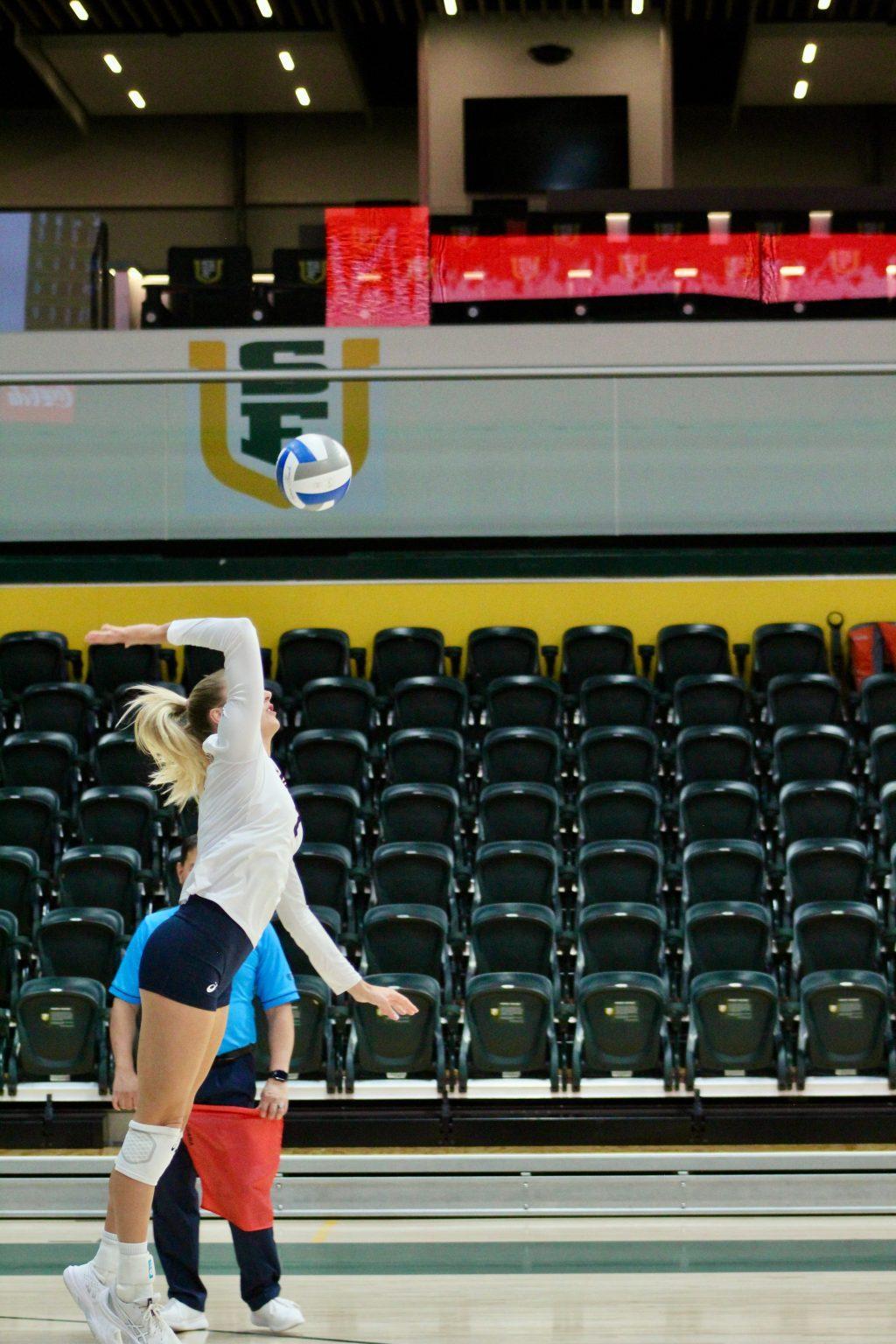 Graduate outside hitter Birdie Hendrickson serves against the Dons on Oct. 25 at the War Memorial at the Sobrato Center. Hendrickson finished with four service aces and 16 digs.