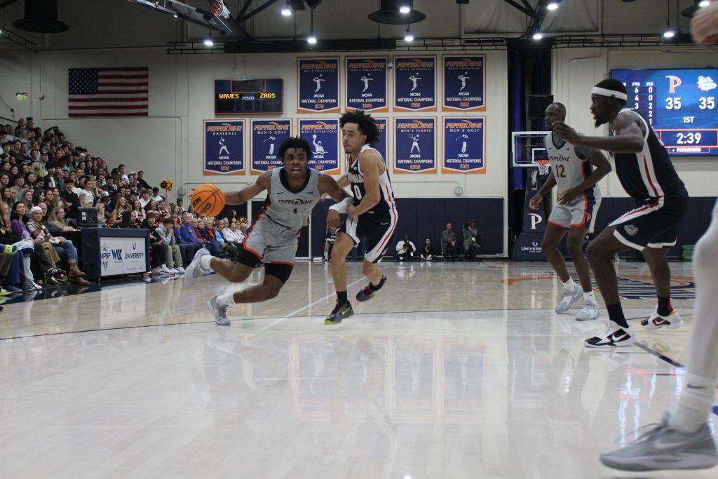 Junior Michael Ajayi drives against the Gonzaga defense Jan. 18 at Firestone Fieldhouse. Washington local Ajayi transferred to Gonzaga after one season with the Waves. Photo by Mary Elisabeth