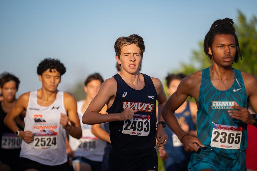 Freshman runner Elijah Gentry runs with a pact of Highlander Invitational racers Oct. 19, at UC Riverside's Ag Ops Course. Gentry recorded a personal best for the second-straight race.