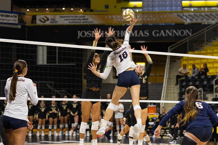 Freshman middle blocker Ella Piskorz strikes the ball over two Long Beach State defenders Sept. 21, at the Walter Pyramid. Piskorz is the reigning WCC Defensive and Player of the Week (Week of Sept. 16).