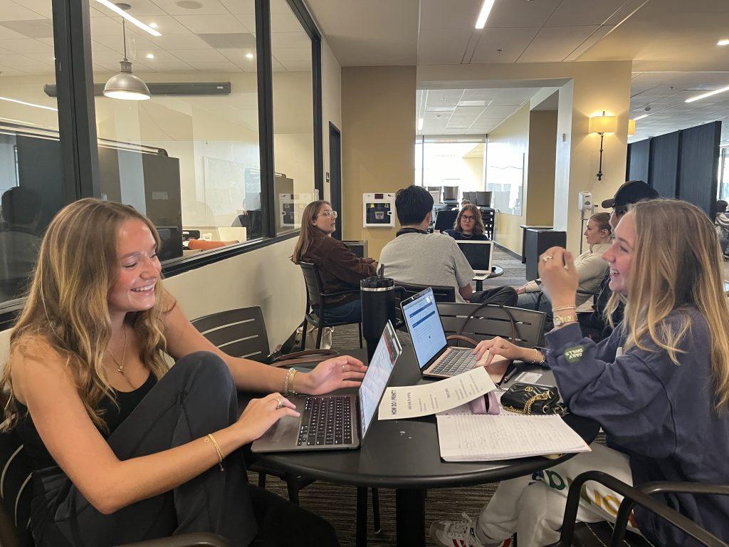 Junior Ali Rehm and first-year Blaire Bodenheimer study together in Payson Library on Oct. 10. They said they have recently started studying together because of their tight-knit sorority. Photo by Viviana Diaz