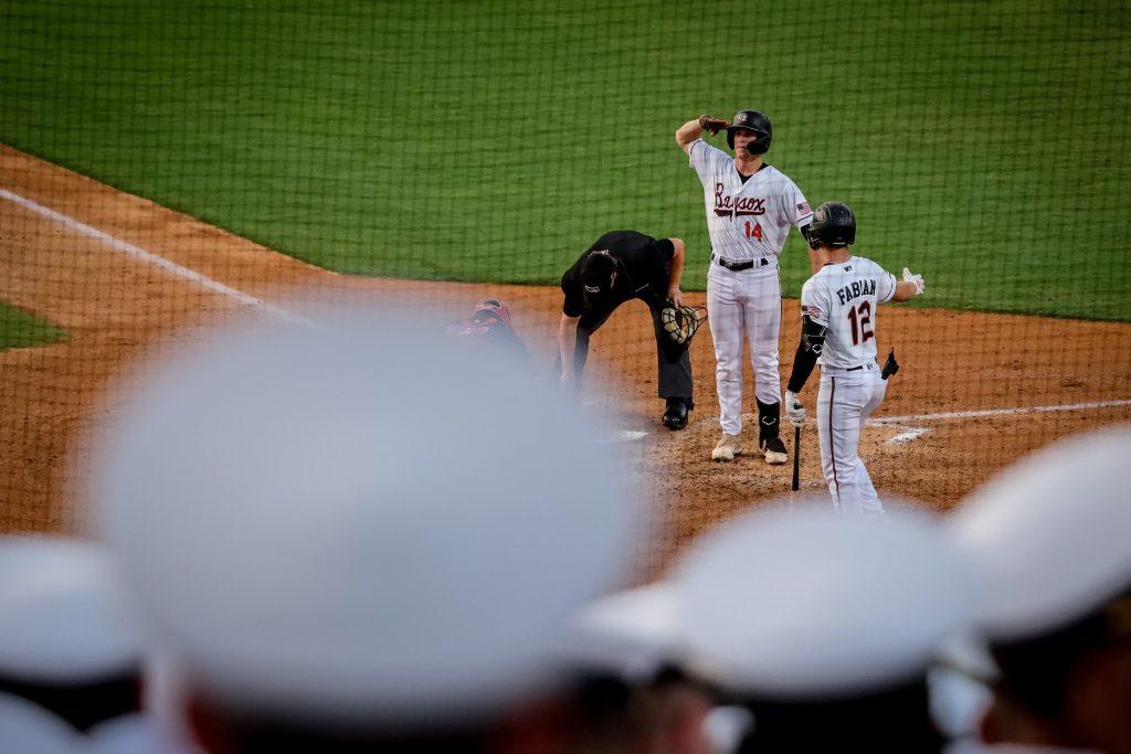 Cook salutes the crowd of Navy Marines during a game for the Bowie Baysox. Cook slugged 25 homers and 18 doubles while swiping 34 bags during his career with the Baysox. Photo courtesy of Billy Cook