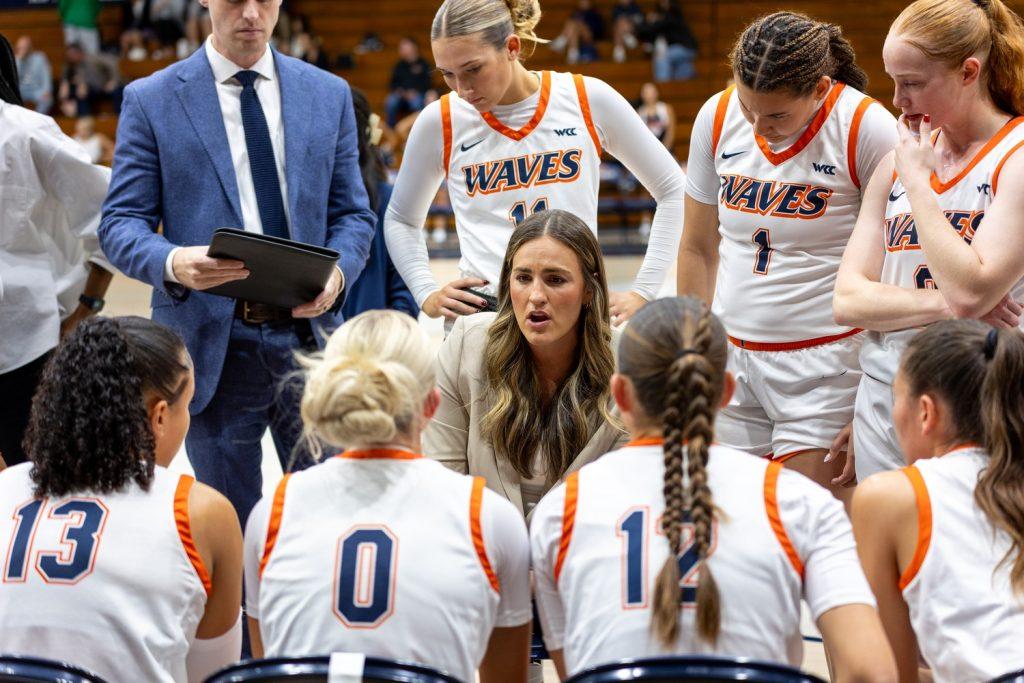 The Women's Basketball team huddles around Head CoachKatie Faulkner at Firestone Fieldhouse for the home game against California State University, Fullerton on Nov. 4. Pepperdine welcomes a brand new season of Women's Basketball. Photo by Colton Rubsamen