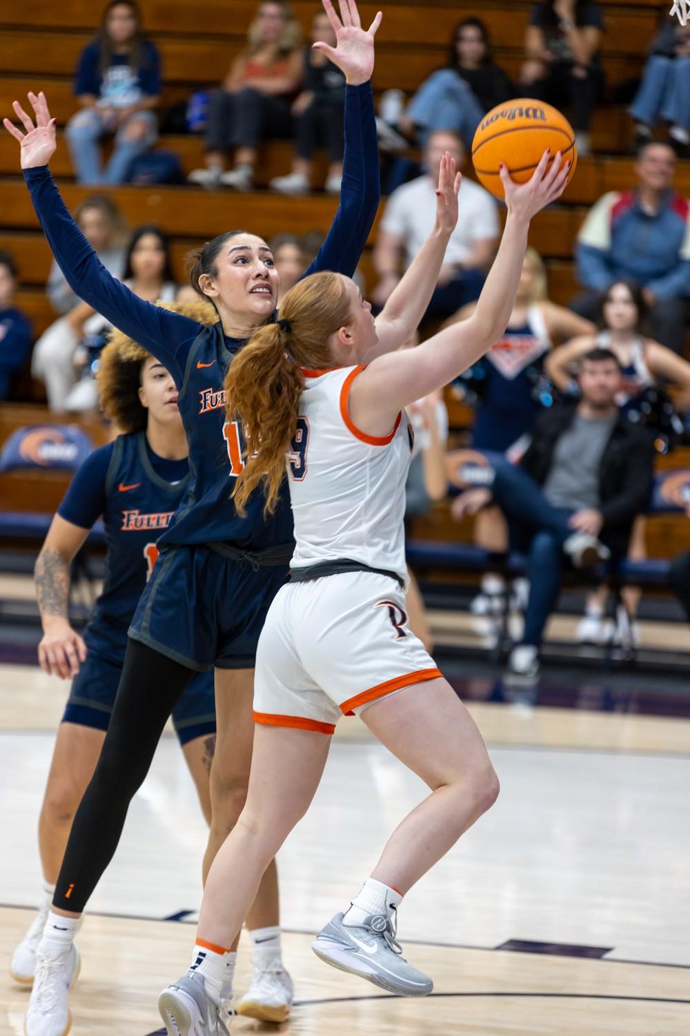 Graduate guard Ornela Muca goes for the layup against the Titans defense Nov. 4 at Firestone Fieldhouse. Muca shot 3-5 from the field, including 2-2 from three to lead the team with 10 points alongside graduate guard Ella Brubaker and Megan Harkey, a senior forward and sports staff writer.