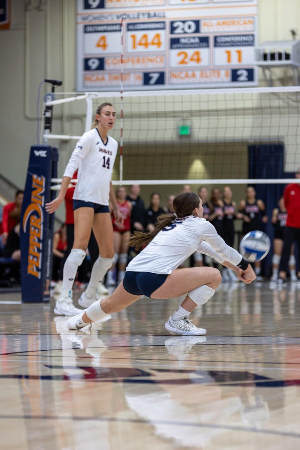 Junior defensive specialist Emma McMahon dives for a dig against LMU at Firestone Fieldhouse on Nov. 7. McMahon had a total of 10 digs against the LMU hitters to end the night.