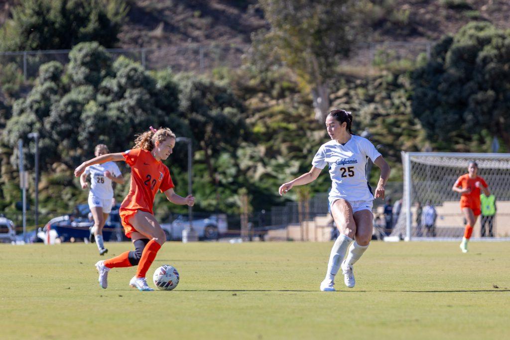 Graduate midfielder/forward Tori Waldeck maintains possession of the ball against a Cal Berkeley defender Nov. 16 at Tari Frahm Rokus Field. Waldeck ended her fifth season with the Waves with 16 games played, 10 goals and two assists.