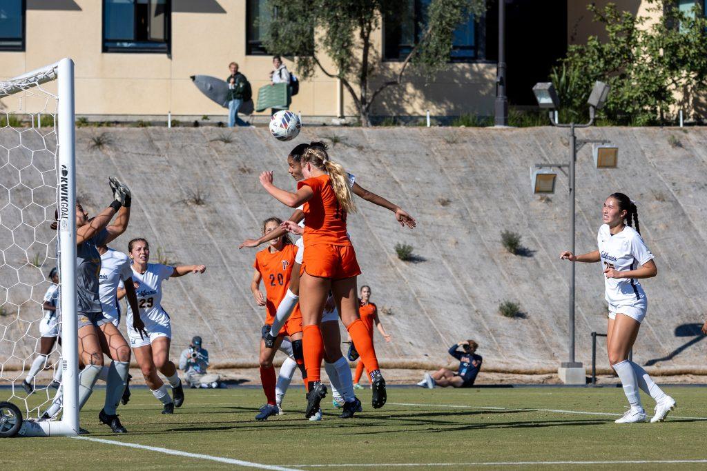 Sophomore defender Peyton Leonard heads the ball toward the net against Cal Berkeley on Nov. 16 at Tari Frahm Rokus Field. This header led to the sole goal for the Waves this game.