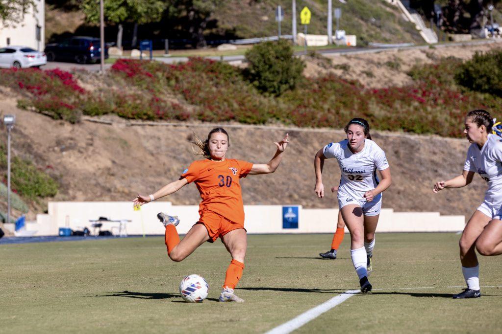 Graduate defender/forward Megan Edelman prepares to kick the ball against the Bears on Nov. 16 at Tari Frahm Rokus Field. Edelman secured two game-winners for the Waves this season.