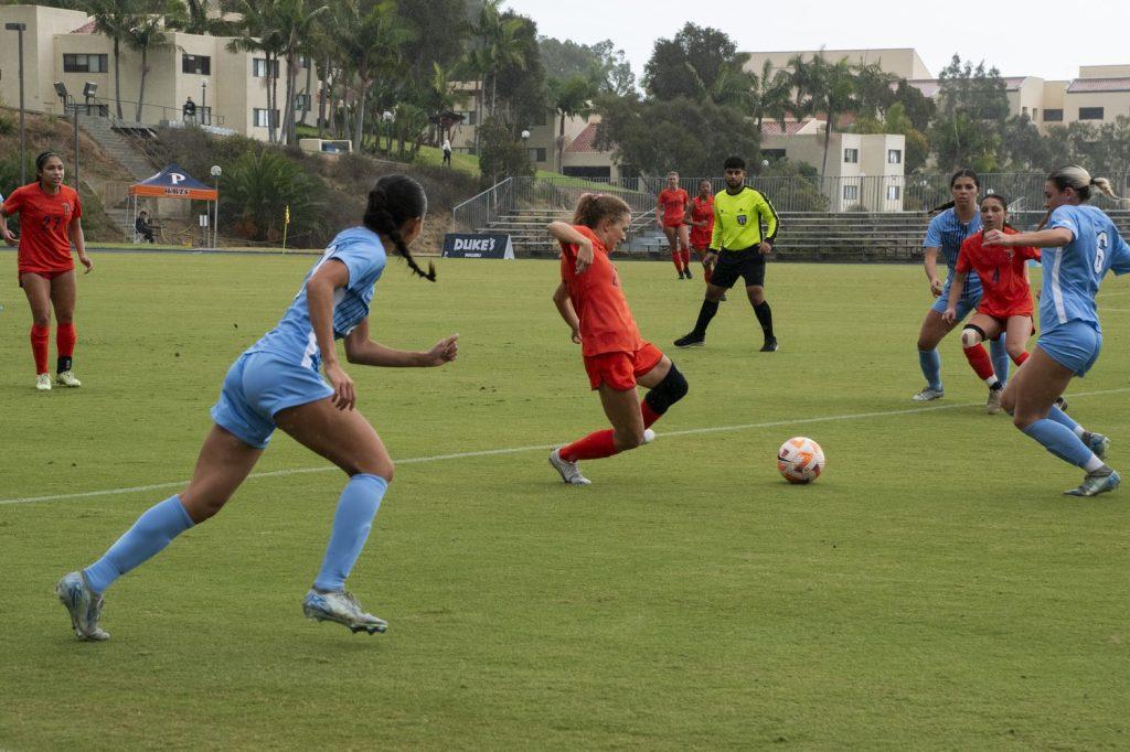 Graduate midfielder/forward Tori Waldeck dribbles down the pitch past the Toreros defense Nov. 2 at Tari Frahm Rokus Field. Waldeck ended the match with two goals to bring her season total to nine. Photos by Perse Klopp