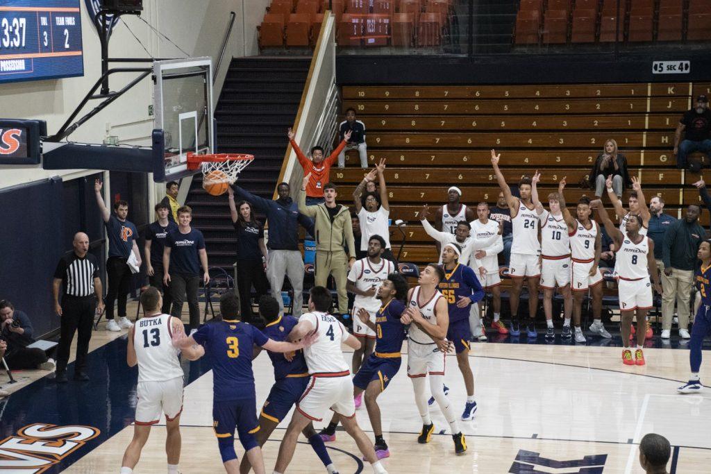 Redshirt junior guard Zion Bethea drains a three-point shot against Western Illinois University on Nov. 6 at Firestone Fieldhouse. Bethea is one of nine new Pepperdine Basketball signees. Photos by Perse Klopp