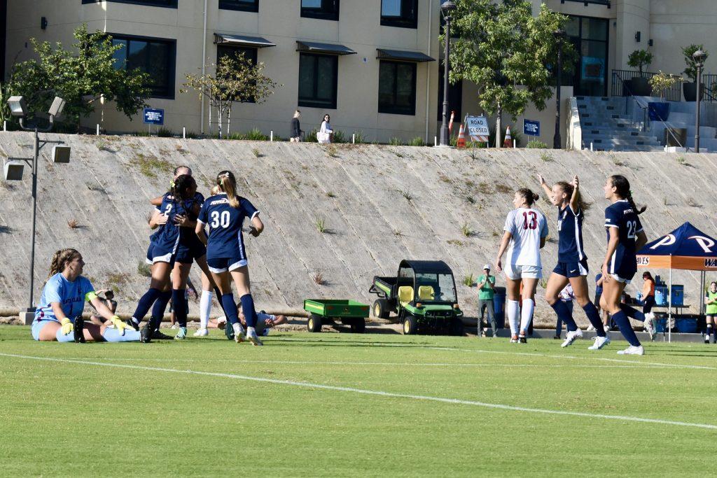 Graduate midfielder/forward Tori Waldeck runs toward her teammates with her hands to the sky following a goal against Santa Clara University on Oct. 9 at Tari Frahm Rokus Field. Photo by Mary Elisabeth