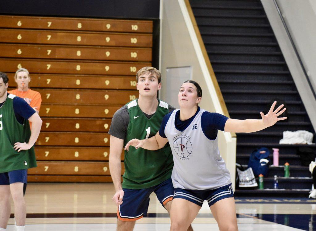 Senior Aidan Shaw defending senior forward Maggie Vick during practice Oct. 31 at Firestone Fieldhouse. Senior guard Helena Friend noted that Shaw has been a member of the scout team since her freshman year.