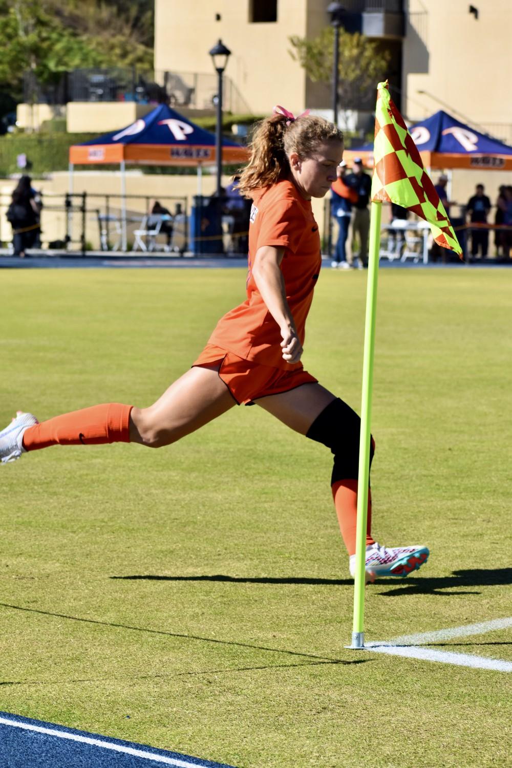 Graduate midfielder/forward Tori Waldeck kicks a corner against San Francisco on Nov. 9 at Tari Frahm Rokus Field. Waldeck led the Waves with 10 goals this season. Photo by Mary Elisabeth