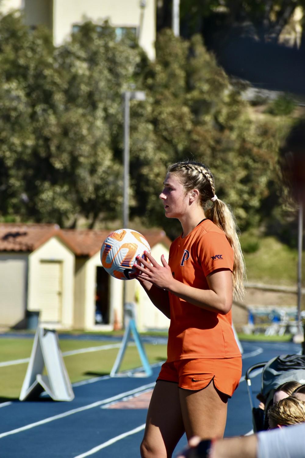 Sophomore defender Peyton Leonard prepares for a throw in against San Francisco on Nov. 9 at Tari Frahm Rokus Field. Leonard has started 19 of the Waves' 20 games this season. Photo by Mary Elisabeth