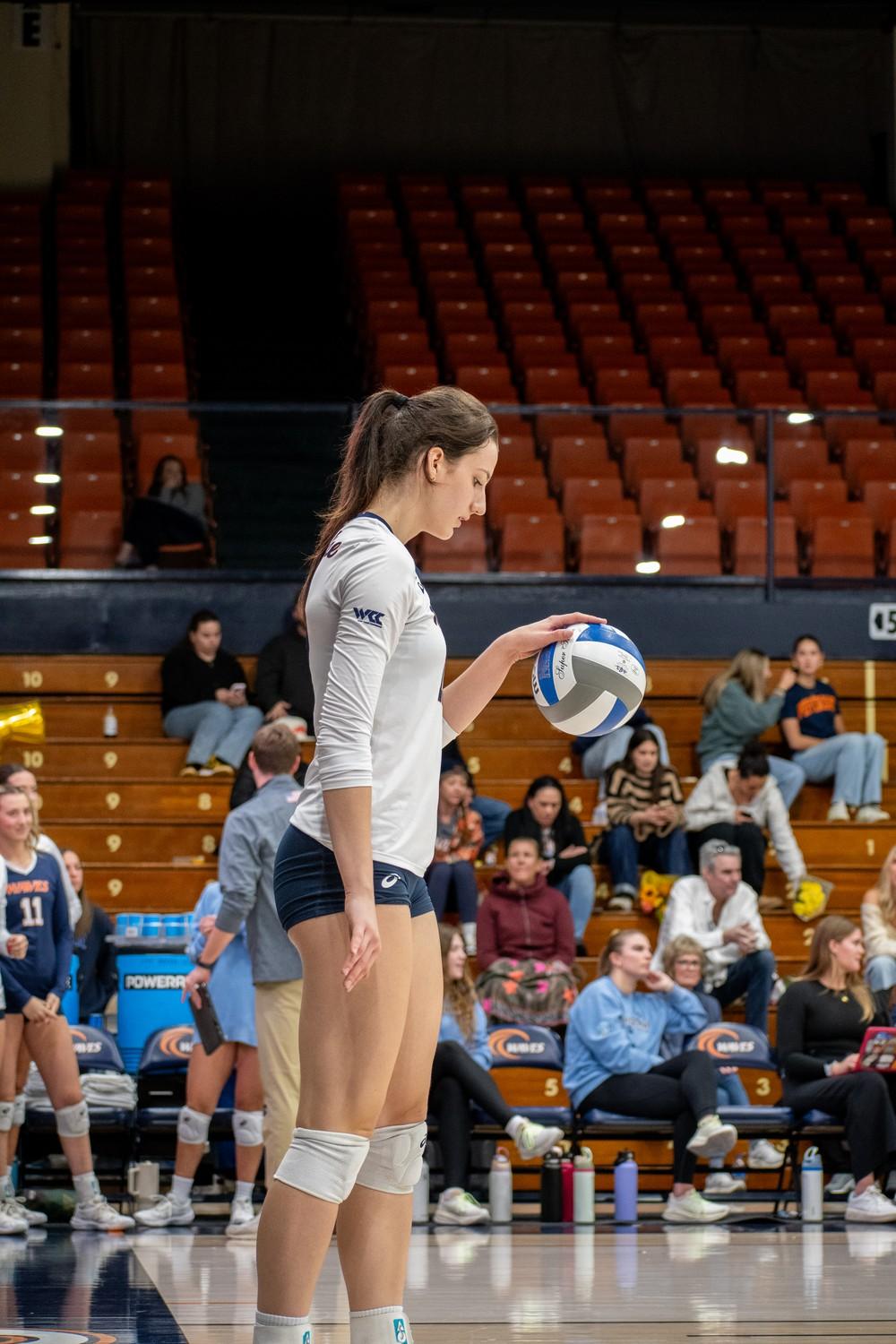 Freshman middle blocker Ella Piskorz gets ready to serve against the Santa Clara defense Nov. 14 at Firestone Fieldhouse. Piskorz ended the match with nine kills and led the team with five block assists.