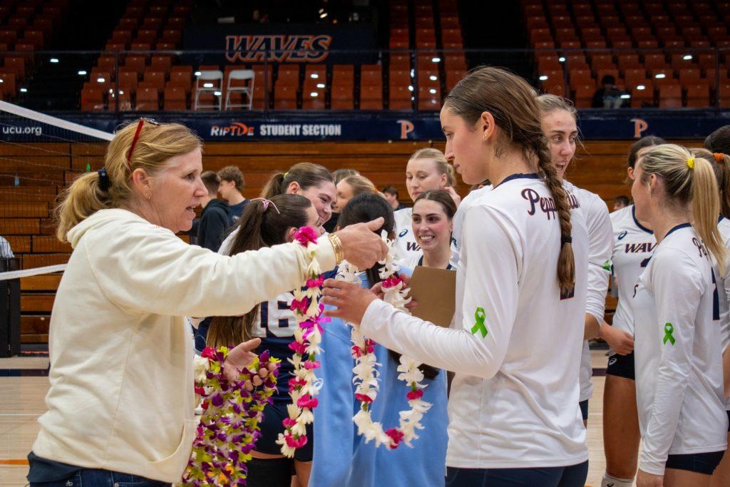 Senior outside hitter Grace Chillingworth accepts her lei necklace for Senior Night on Nov. 14 at Firestone Fieldhouse. Chillingworth played four seasons with the Waves and recorded 1305 kills in her career. Photos by Colton Rubsamen