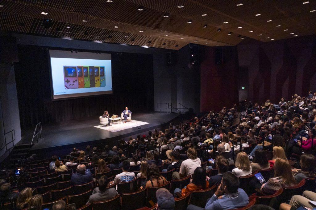 Luckey introducing his newest product: The Mod Retro Chromatic on Oct. 1 in Smother's Theatre. The product is compatible with the GameBoy cartridge. Photo courtesy of Ron Hall