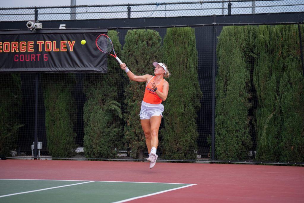 Freshman Taylor Goetz jumps for a swing at the Women of Troy Invite on Oct. 4 at David X. Marks Tennis Stadium. Goetz went 4-1 on the weekend in her singles and doubles matches. Photos courtesy of Pepperdine Athletics.