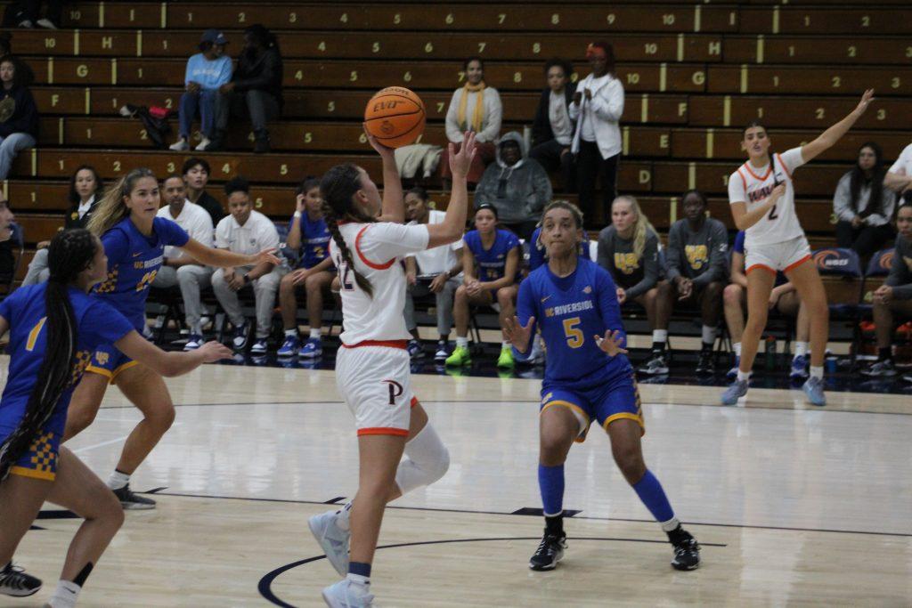 Makena goes for a layup against the Highlanders on Nov. 18 at Firestone Fieldhouse. Makena would get the only three-pointer to fall for Pepperdine this match.