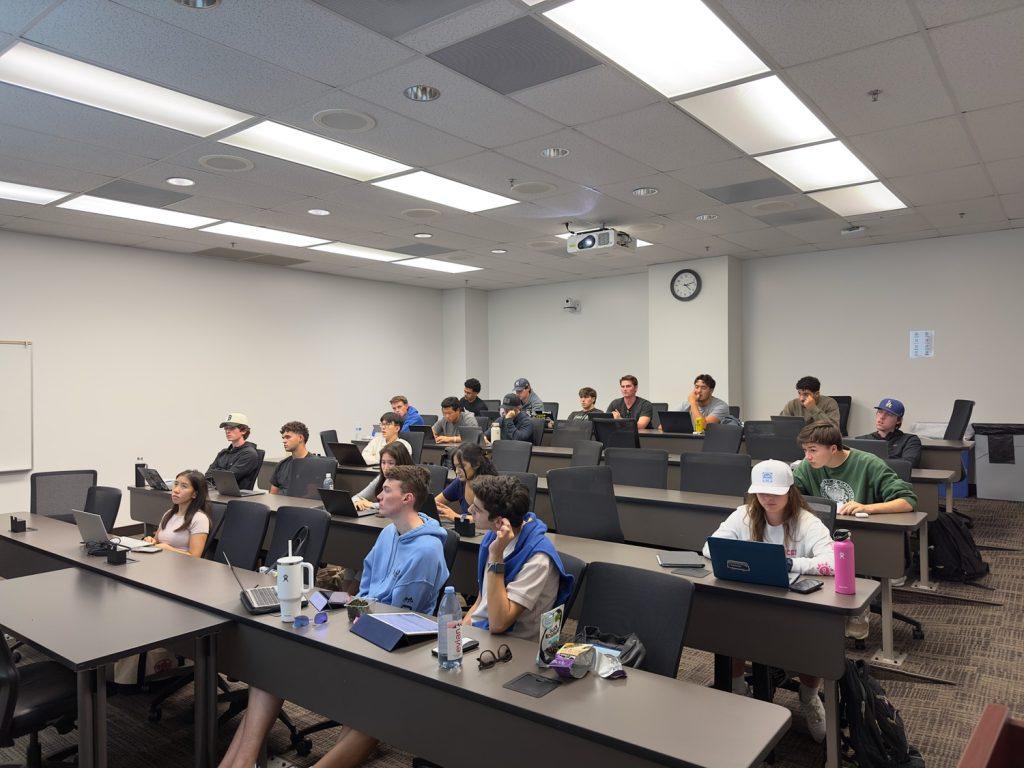 Students sit in Professor Rodney Ndum’s investments class Oct. 21. This semester, Ndum's class consists of four times as many men as women. Photo by Henry Adams