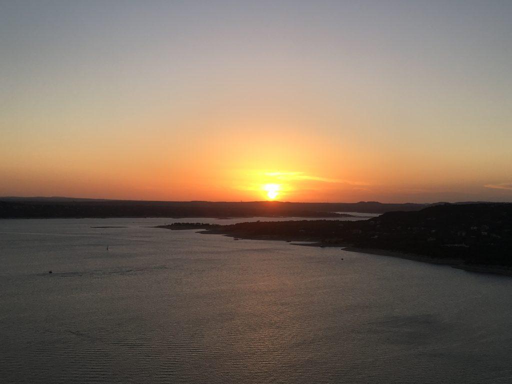 The sun setting over Lake Travis in Austin, Texas on July 14, 2018. This was the view from the patio of the Oasis, an Austin restaurant known for its great views of the sunset.