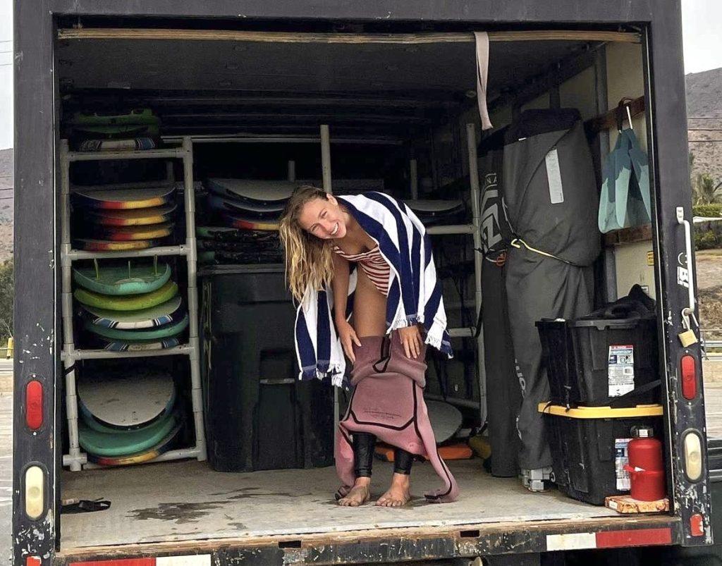 Junior Vianita Correa gets ready for a surf lesson in the back of a truck, where the equipment is hauled to Malibu Beach on Sept. 14. She said being so close to the beach makes it easy to be active while having a good time. Photo courtesy of Vianita Correa