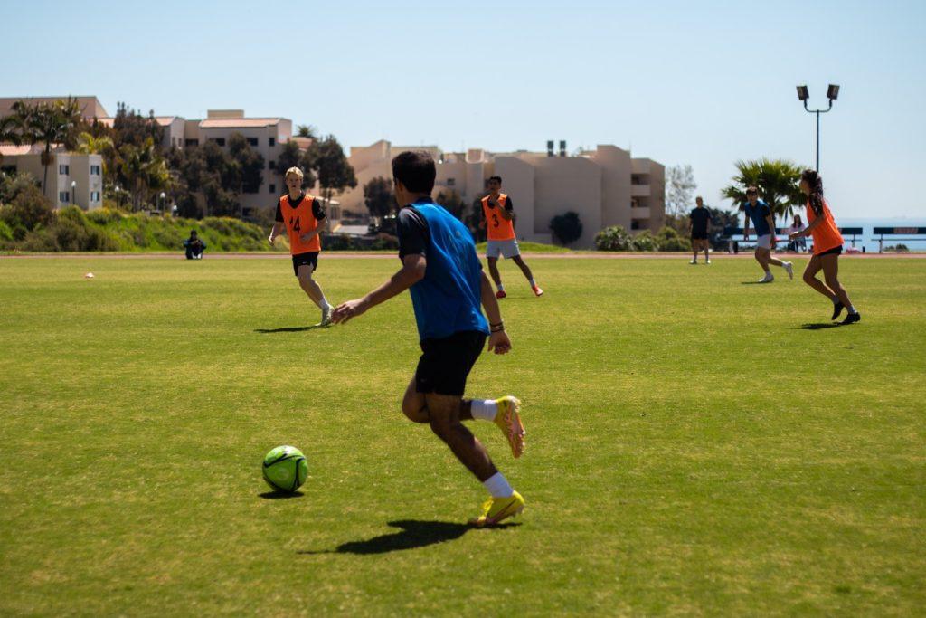 Mario Andre Dominguez controls the ball during the Intramural Soccer Spring '24 Championship Game on April 6 at Tari Frahm Rokus Field. Rec sports offers intramural and club sports, with different leagues to match students' skills and goals with the sport, to learn or to try and win. Photo courtesy of Julian Baker