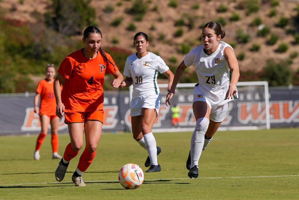 Freshman midfielder Elle Quinn dribbles the ball against San Francisco on Nov. 9 at Tari Frahm Rokus Field. Quinn ended conference play with one goal and three assists. Photo courtesy of Pepperdine Athletics