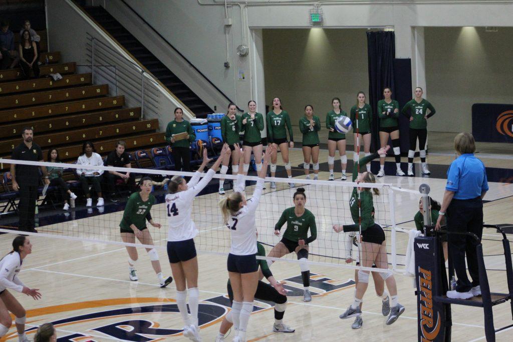 Junior middle blocker Kenadie Patterson and outside hitter/opposite Birdie Hendrickson jump up for a block against the University of San Francisco on Nov. 16 at Firestone Fieldhouse. Pepperdine finished the game with 9 blocks.