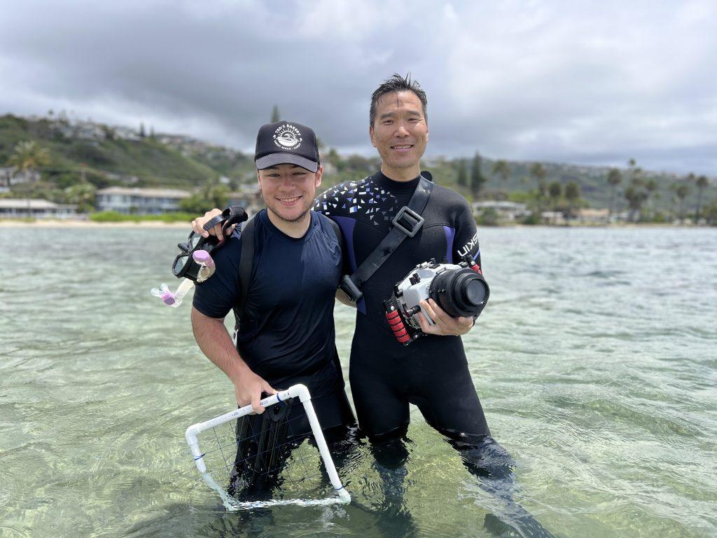 Senior Screen Arts major Nick Yi (left) and Kim (right) pose for a photo in the ocean during filming for their documentary in May. Yi said he greatly admires Kim's work, and felt honored to be brought onto the project.