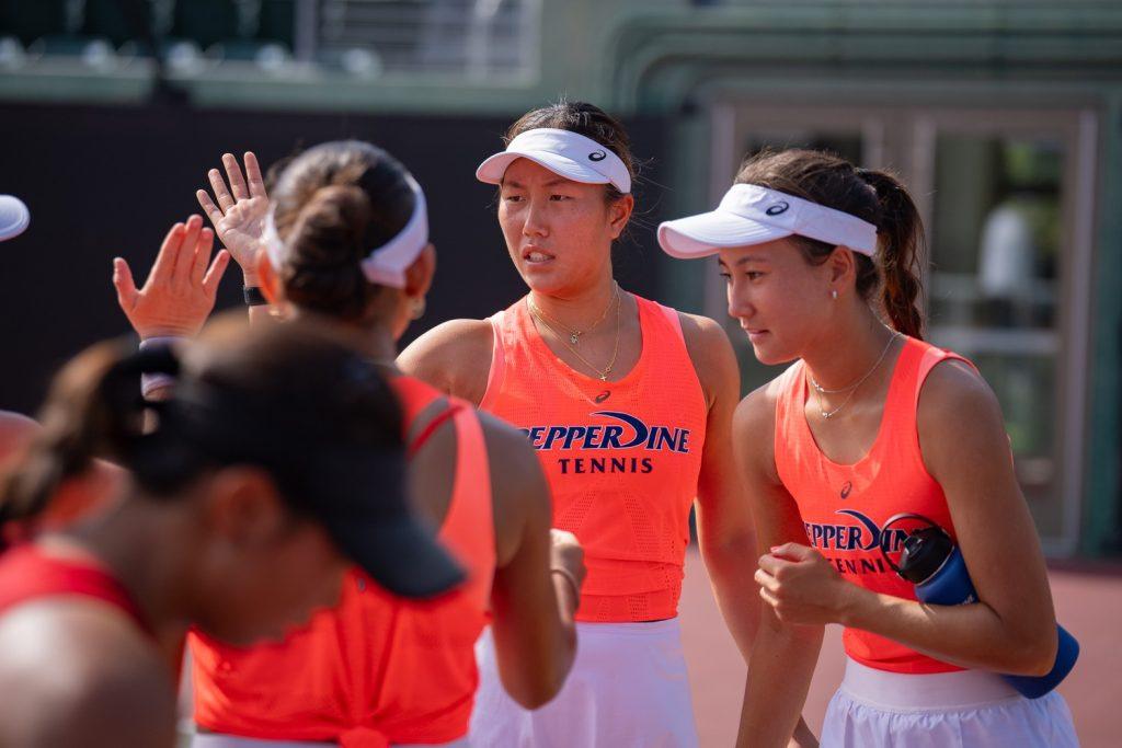 Sophomore Vivian Yang high fives her teammates at the Women of Troy Invite on Oct. 4 at David X. Marks Tennis Stadium. Yang will be competing in the NCAA Doubles Championship starting Nov. 17 with senior Savannah Broadus in Waco, Texas.