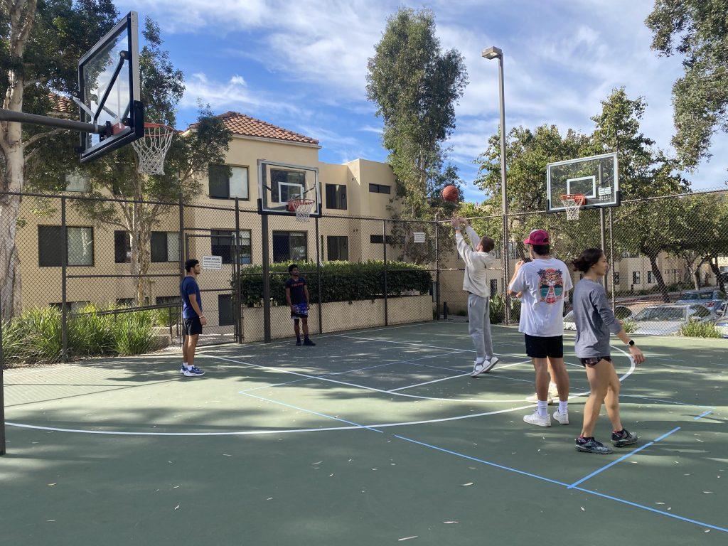 A student shoots a free throw during Basketball Chapel at the Towers basketball court. Resident director Spencer Slater hosts Basketball Chapel on Wednesdays at 11 a.m. Photo courtesy of Isabella Knudson