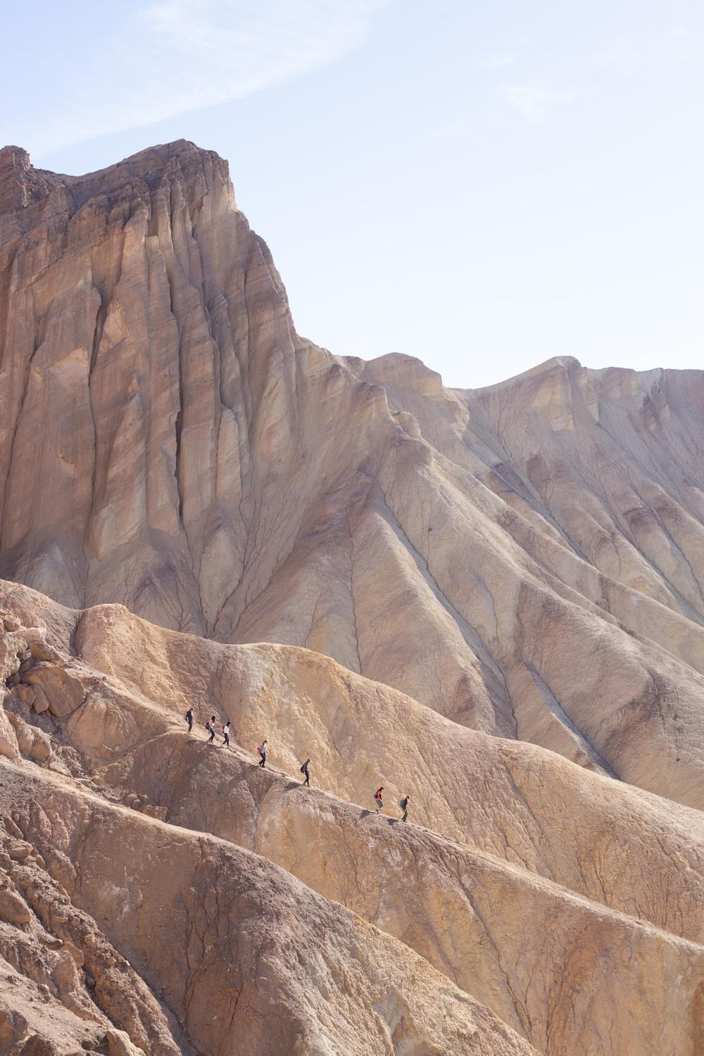 A group of students walking down the spine of a hill in the Golden Canyon labyrinth in Death Valley National Park during their Death Valley Camping Trip from Jan. 12 through Jan. 14. Ramli said they like to go on mountain-focused trips during the spring when the weather is cooler. Photo courtesy of Kiana Ramli