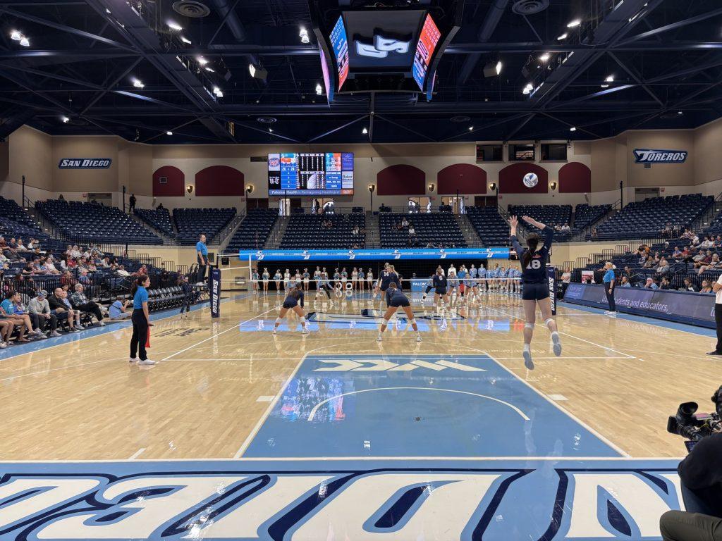 Freshman middle blocker Ella Piskorz serves against the University of San Diego on Nov. 9, in the Jenny Craig Pavilion. Piskorz finished with five kills, three aces and two blocks, according to Pepperdine Athletics. Photo courtesy of Jackie Marquez/The USD Vista