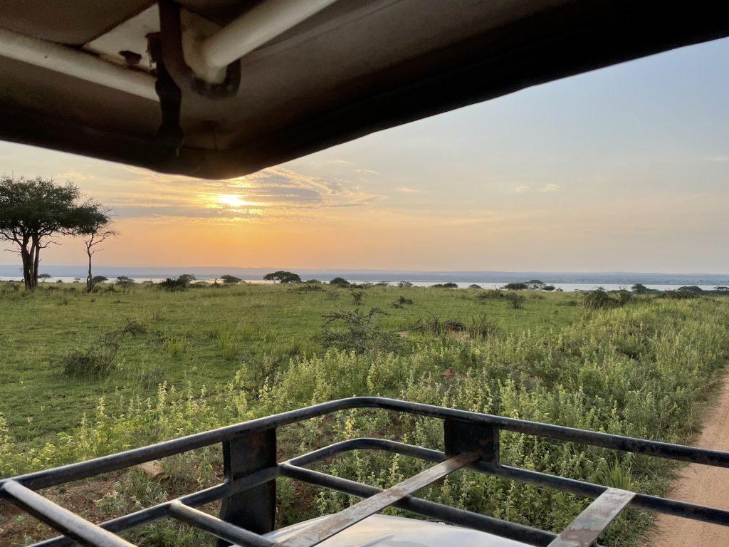 A sunset from a safari vehicle in Uganda on June 25, 2022. The top of the van opened up so we could stand up and take pictures.