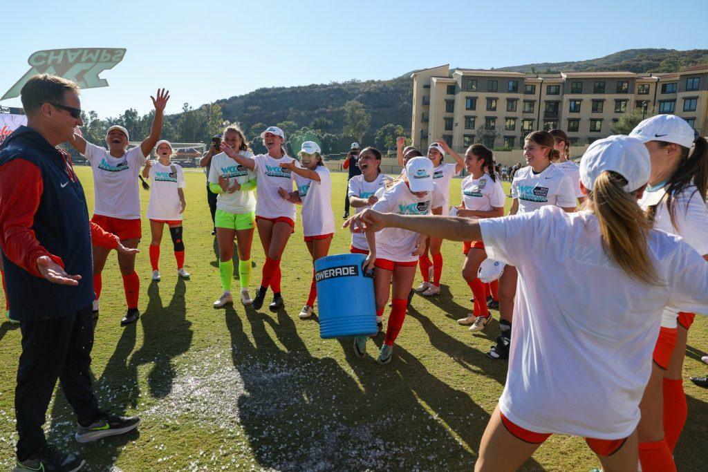 The Waves cheer after dunking Head Coach Tim Ward with an ice bucket following their WCC title-clinching victory over San Francisco on Nov. 9 at Tari Frahm Rokus Field. So far, in Ward's 27-year career with Pepperdine, he has led the Waves to all five WCC titles in program history. Photo courtesy of Pepperdine Athletics