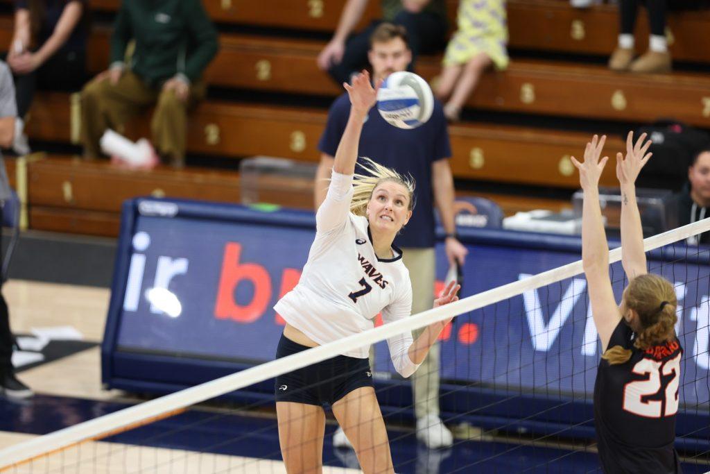 Graduate outside hitter Birdie Hendrickson attacks against the Oregon State defense Nov. 30 at Firestone Fieldhouse. Hendrickson ended with a match-high 20 kills to mark the end of her career with the Waves.